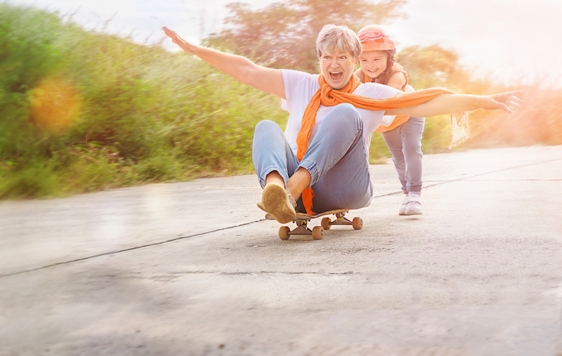 Reclaim Your Energy Levels During Menopause - child pushing woman sitting on skateboard